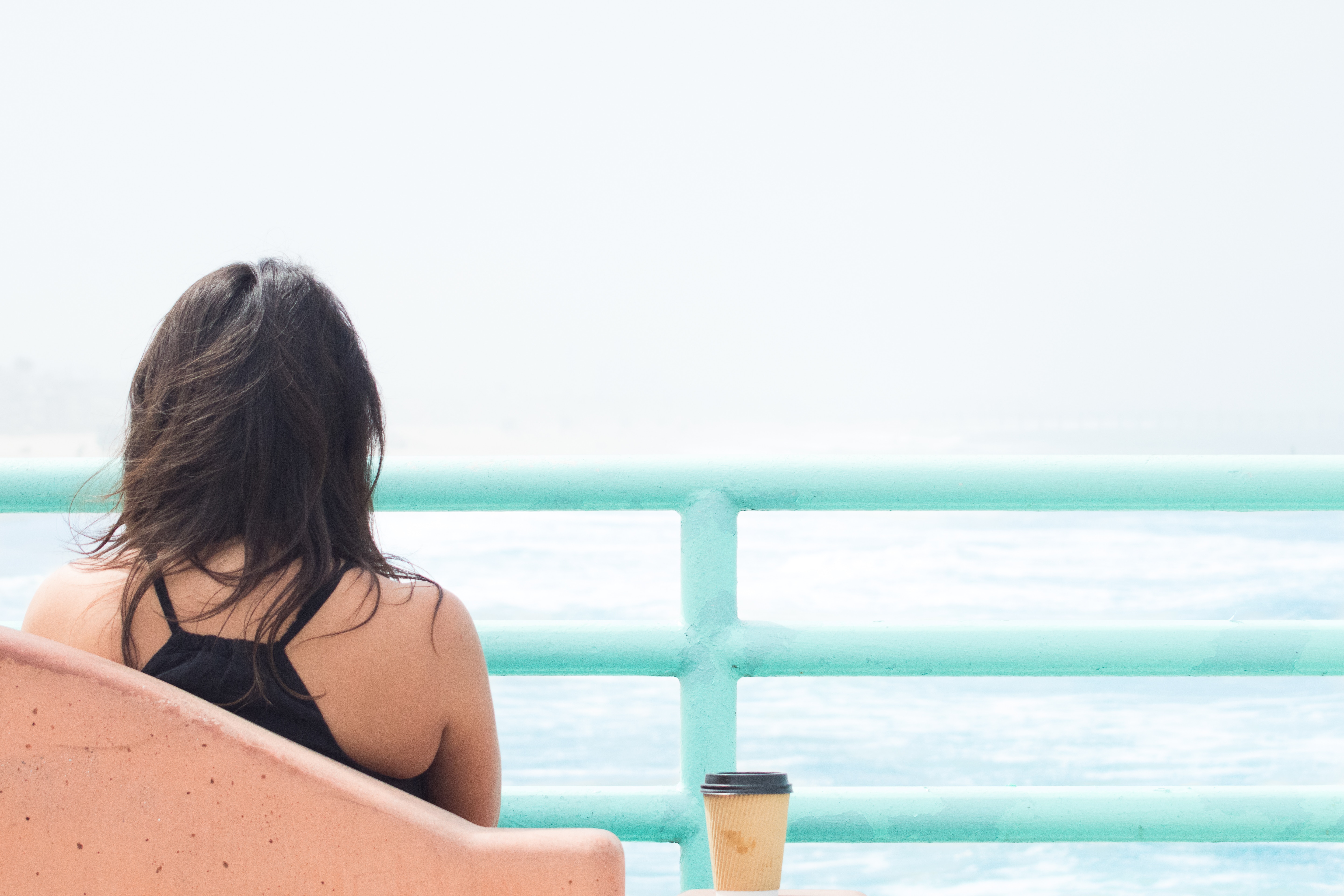 Get Recharged - Girl at beach with coffee